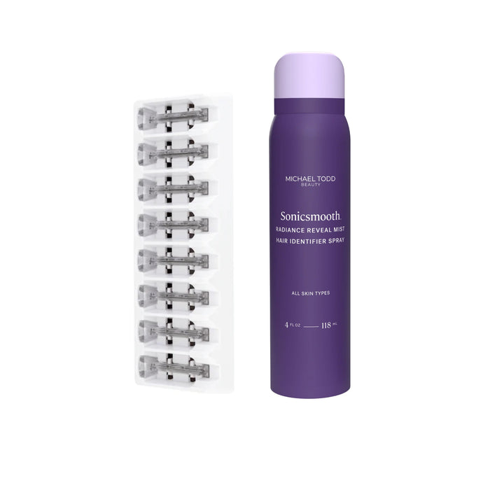 A purple can of Michael Todd Beauty Dermaplaning Essentials Kit stands next to a pack of replacement razor blades arranged in two rows.