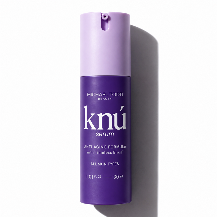 A bottle of Michael Todd Beauty Knú Serum, containing peptides for skin regeneration, on a white background. visible_badge