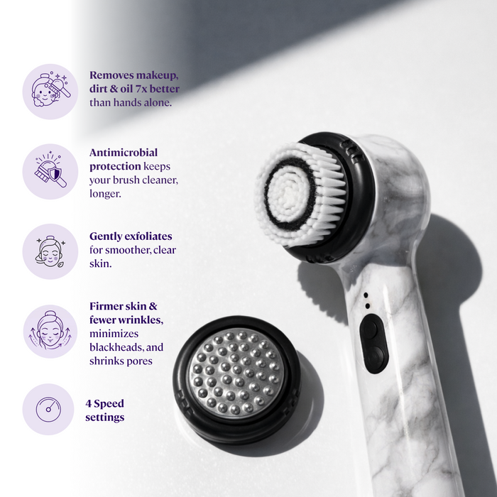 White Marble The Michael Todd Beauty Soniclear, an electric facial cleansing brush with two interchangeable, dermatologist-recommended antimicrobial brushes, is shown on a white surface with text highlighting its features and benefits.