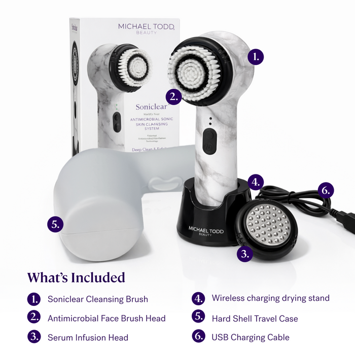 White Marble The Michael Todd Beauty Soniclear set includes antimicrobial brushes, a charging stand, serum infusion head, travel case, and USB charging cable.