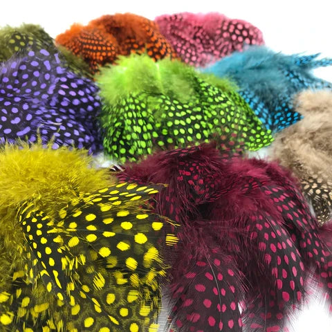 Hareline Strung Guinea Feathers – premium fly tying feathers featuring bold natural speckling in a wide variety of vibrant and natural colors, perfect for steelhead flies, collars, cheeks, and intruder patterns.